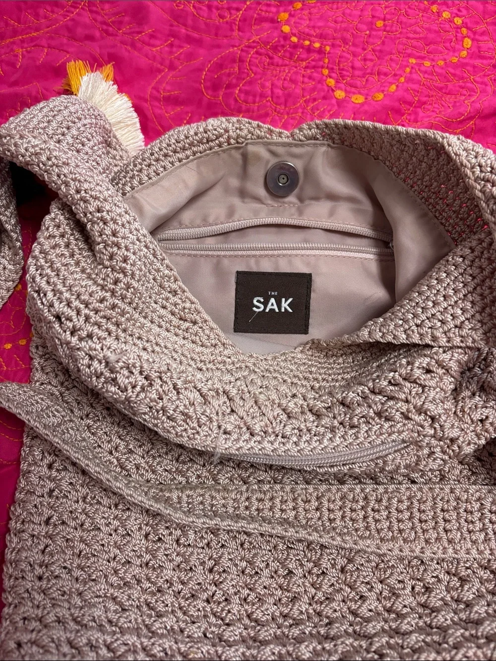The Sak Crochet Satchel in Beige with Teal, Red, White & Yellow Tassels